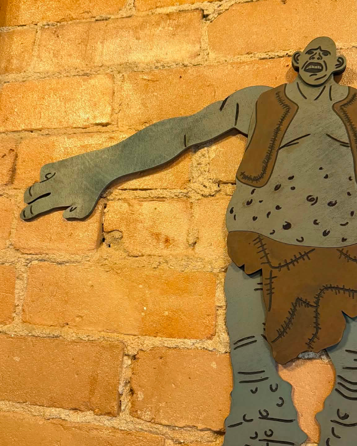 Mountain Troll Wooden Sign with Winging Legs